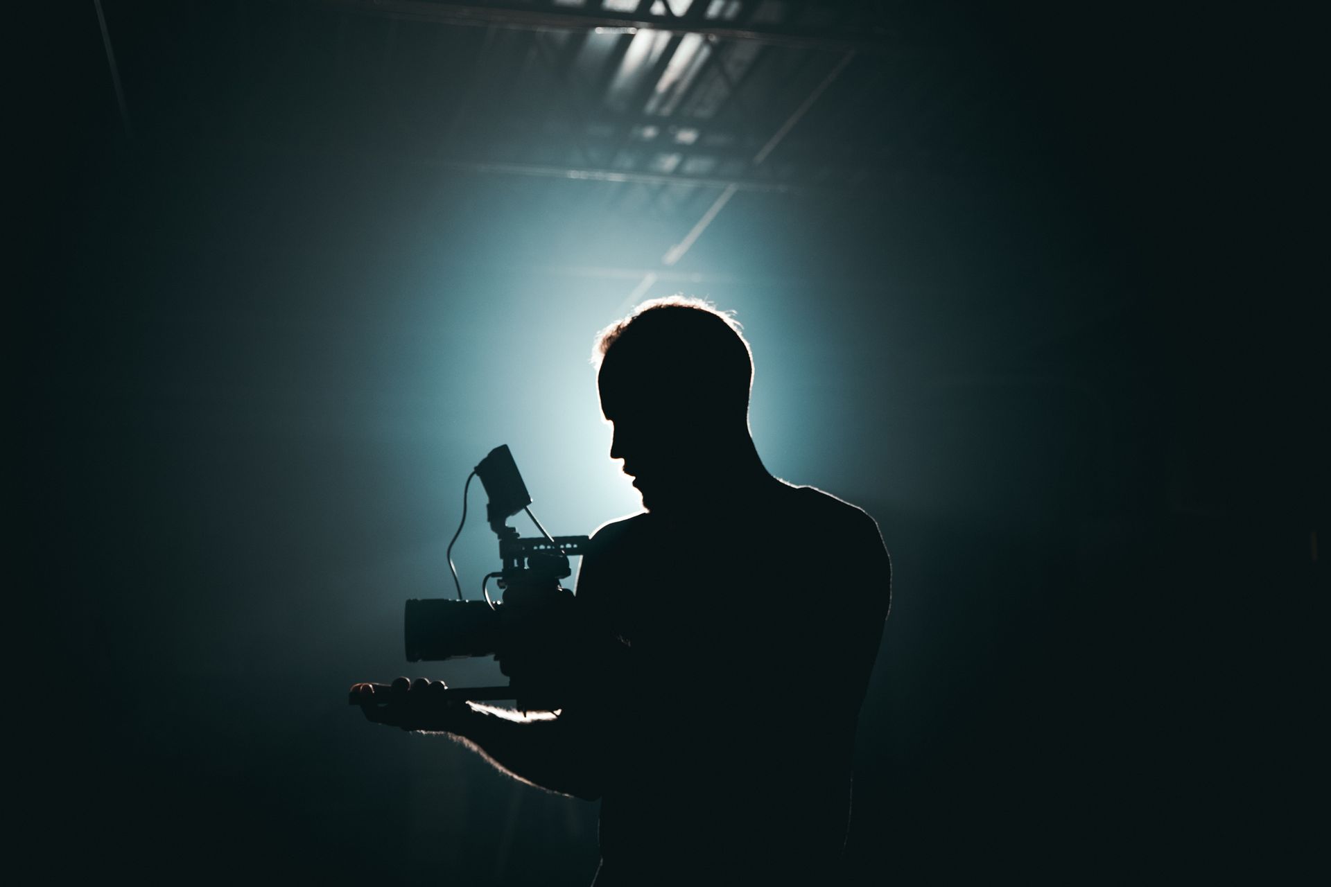 A camera operator filming a live performance
